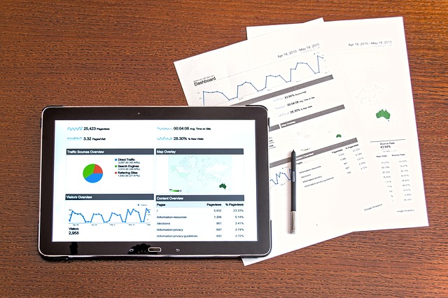 website analytics on tablet and paper